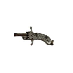 Miniature nickel .22 pin fire single shot pistol with engraved grip and suspension ring to the butt