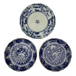 Pair of Japanese Edo period Arita blue and white dishes, centrally painted with flowering branches and trailing leaves and a border of mythical creatures and vases, shaped brown painted rims, D18.5cm, together with another Japanese Artia ware dish, painted in blue and white, Chenghua six-character mark beneath (3)