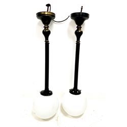 Pair of black and gilt metal pendant light fittings with opaque glass shades
