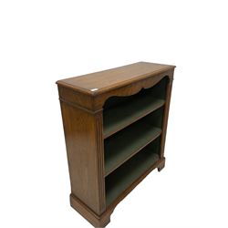 20th century oak open bookcase, fitted with two adjustable shelves, raised on bracket supports 