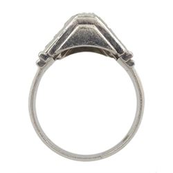 Platinum baguette and round brilliant cut diamond ring, the central row with seven channel set baguette cut diamonds, each side with seven round brilliant cut diamonds, in a stepped triangular design setting