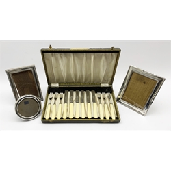 Silver upright photograph frame H17cm Birmingham 1916, another with bead edge decoration H16cm, a circular frame and a cased set of six plated dessert knives and forks
