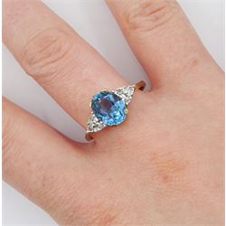 9ct gold oval blue topaz and diamond ring, hallmarked