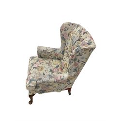 Parker Knoll - wingback armchair upholstered in crimson patterned fabric, raised on cabriole supports, with foliate and bird patterned chair cover