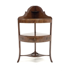 Georgian mahogany bow front wash stand, raised shaped back with open shelf over fitted panel covering washbowl recesses, one drawer under, raised on slender splayed supports, with boxwood stringing throughout 