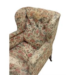William Bertram & Son of London - late 19th century wingback armchair, upholstered in floral button-back fabric with sprung seat, mahogany ring turned front supports, the brass castors stamped 'Bertram & Son 100 Dean St W.'

Bertram, William; Bertram & Son of London; upholsterer, looking glass maker, carver, gilder and cabinet maker (fl.1839-1902).

From 1878 the business was listed as Bertram & Son at 100 & 101 Dean Street, Soho. This change in business dates the chair to between 1878 and 1902.