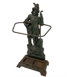 Victorian cast iron stick or umbrella stand, figure of Dick Whittington back, inset drip tray registration number to the reverse, in antique green finish