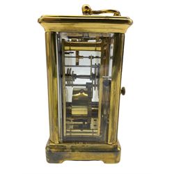 A French early 20th century eight-day Corniche timepiece carriage clock with a jewelled lever platform escapement with timing screws, white enamel dial with Roman numerals, minute markers and steel spade hands, bevelled glass panels to the case and a rectangular glass panel to the top of the case with original base plate.
With Key.
