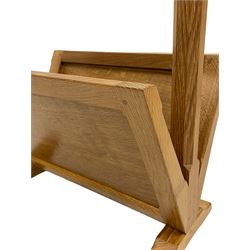 Mouseman - oak magazine rack, shaped cresting rail with pierced handle and carved mouse signature on octagonal supports, two sloping panelled sides on sledge feet, by the workshop of Robert Thompson, Kilburn