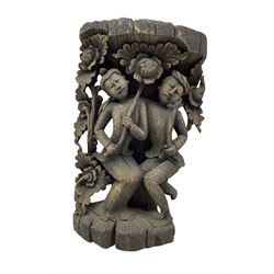 South-east Asian softwood carving of two figures holding flowers, H51cm 