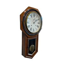 Ansonia - American 19th-century 8-day spring driven wall clock, with a twin train movement striking the hours on a gong, with an eighteen-inch octagonal wooden bezel and twelve-inch painted dial with Roman numerals and second’s dial, original steel hands (minute hand detached but present) within a flat glass and spun brass bezel, mahogany  and ebonised case with a  fully glazed trunk door and visible pendulum with a brass bob. 