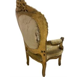 Pair mid-20th century gilt wood armchairs, the cresting pierced and carved with c-scrolls and foliate, upholstered in floral pattern fabric with raised decoration, floral carved arm terminals and uprights, the apron carved with shell