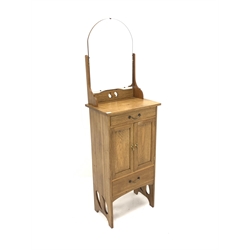 Arts and Crafts style light oak wash stand cabinet, with raised back over two drawers and a cupboard enclosing fixed shelf, raised on peirced panel end supports, W55cm, H150cm, D37cm