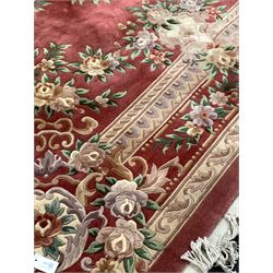 Chinese washed woollen pink ground carpet with floral design and boarded 280cm x 390cm