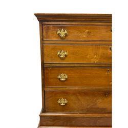 19th century walnut chest on stand, projecting moulded cornice over four long graduating drawers, the stand with shaped apron on angular cabriole supports with ball and claw carved feet