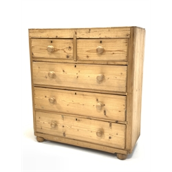 Early 20th century pine chest, fitted with two short and three long drawers, raised on bun supports 