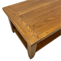 Light oak rectangular coffee table, square supports joined by under-tier 