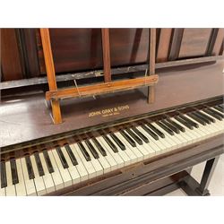 John Grey & Son of York and Hull - mid 20th-century upright overstrung iron framed piano with an under damper action, in a mahogany case with three front panels and a folding music desk, serial No 5641, original stringing, hammers and dampers.