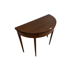 George III mahogany tilt top table, the fold over top with reeded edge raised on squared tapering supports 