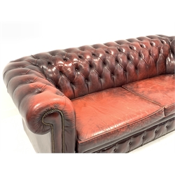 Late 20th century three seat chesterfield sofa upholstered in deeply buttoned red leather, W225cm, D98cm