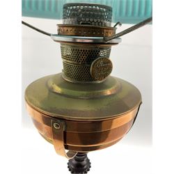Late 19th century turned wooden oil lamp with copper frame and reservoir, green glass ribbed shade and clear glass chimney, H63cm (to green shade)