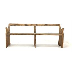 Early 20th century pine pew bench with shaped panel end supports W187cm,