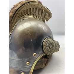 French Model 1874 Cuirassier helmet with steel skull, the brass comb embossed with beaded fluting and terminating with the head of Medusa, above a flaming grenade flanked by laurel leaves, with replacement plume and brown gilt embossed leather liner, H26cm