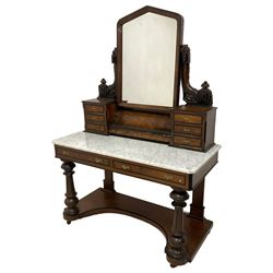 Late Victorian Aesthetic Movement walnut and ebonised dressing table, raised mirror back supported by foliate carved and pierced horns, three banks of small drawers and central hinged compartment, canted and chamfered white marble top over two drawers, turned and fluted supports on shaped platform 