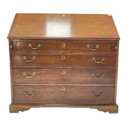 Georgian oak bureau, the fall front enclosing nine drawers, over four long graduated drawers to base, raised on bracket supports W110cm, H105cm, D55cm