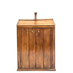 Late 19th century varnished pine two door cupboard, loosely formed as a dolls house, the interior fitted with shelves, W70cm, H109cm, D46cm