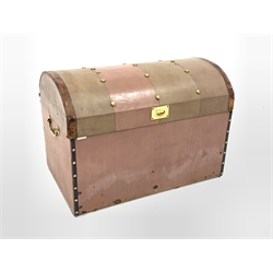 Early 20th century dome top trunk, with studded top, covered and bound in leather, interior lined with striped blue fabric, two division lift out tray, bearing paper label for 'Bick Bros, Cheltenham' W84cm