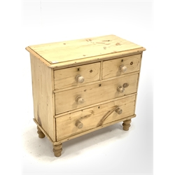 Victorian polished pine chest fitted with two short and two long drawers, raised on turned supports 