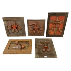 Four cast metal and wood industrial engineering casting moulds or foundry forms, framed, largest L73cm x W 53cm