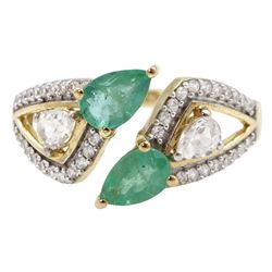 9ct gold pear shaped emerald and white zircon openwork crossover ring, hallmarked 