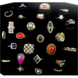 Collection of twenty-five silver and stone set silver rings including goldstone, garnet, cubic zirconia, onyx and marcasite, all stamped or tested (25)