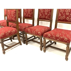 Set of six late Victorian oak Puginesque chairs, with carved and chamfered decoration, open back rest, spiral turned front supports, with back and seat upholstered in red fabric, W53cm