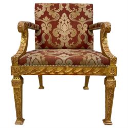 After William Kent - Georgian design giltwood open armchair, scrolled arm supports with scaled sides, acanthus leaf terminal and trailing bellflower decoration, the wide seat, back and arms upholstered in red and silver foliate pattern fabric, the frieze rails decorated with wave decoration and with applied shell motifs, the square tapering supports with vertical bellflowers 