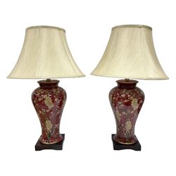 Pair of large table lamps of tapering form, decorated with Japanese blossom on a red ground, upon a square base, H72cm