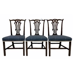 Set six Georgian mahogany dining chairs, Chippendale design, shaped cresting rails relief carved with foliate motifs over Gothic type pierced splats, over stuffed upholstered seats in blue fabric, square front supports with inner chamfer joined by plain stretchers, seat width - 56cm, seat height - 49cm, total height - 97cm