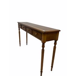 Regency style hardwood hall console table, the figured cross banded top with satinwood inlay over four cock beaded frieze drawers raised on turned reeded supports W131cm