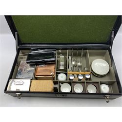 Early 20th century Automobile 'Running Board' camping/ picnic set, the twin handled black leather cloth case with plated mounts, opening to reveal a fitted interior with a Thermos Bottle, three wicker bound bottles or flasks, two food tins, Brooks square copper kettle, five Doric China teacups & six saucers, silver-plated cutlery, skewers etc, L75cm, D38cm, H16cm