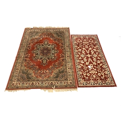 Two machine made Persian design red ground rugs 