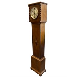 Mid-20th century oak cased Grandmother clock striking the hours and half-hours on a coiled gong,  with a silvered dial, Arabic numerals and steel hands within a spun bezel and convex glass, case with a flat top and barley twist columns to the hood, trunk with applied beadwork and lozenge moulding, on a square pediment with a decorative skirting.  