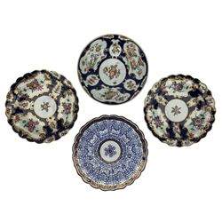 Group of First Period Worcester, including a blue scale dish with kakiemon floral reserves, fretted square mark, D18cm, two blue scale and floral decorated dishes with scalloped edges, W marks and a Royal Lily pattern dish, blue crescent mark (4)