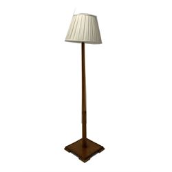 Early 20th century Art Deco walnut standard lamp, square tapered upright on a moulded square base, together with a later shade H178cm