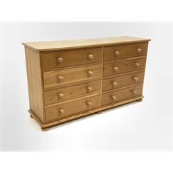 Solid pine chest, fitted with two banks of four drawers, raised on bun supports W153cm, H86cm, D45cm