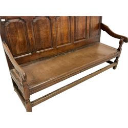 18th century oak settle, moulded cresting rail over five arched fielded back panels and downswept arms, raised on turned supports united by stretchers