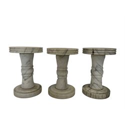 White veined marble circular garden pedestal table, and six marble pedestal stools