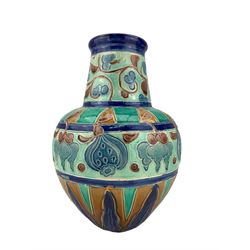 Burmantofts Faience partie-colour vase, of shouldered form tapered neck, designed by Joseph Walmsley, tube lined and incised with fruit, flowers and geometric decoration, impressed factory marks beneath and indistinct model number,  H23cm