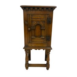 Jacobean style oak cupboard on stand, fitted with single drawer